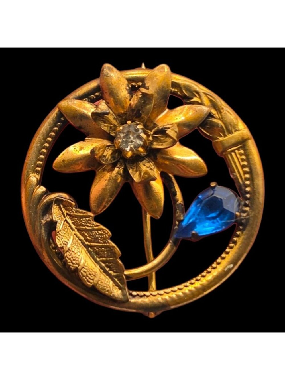 Antique Gold-Tone Floral Brooch Glass Blue Rhinestone Accent Circular Design